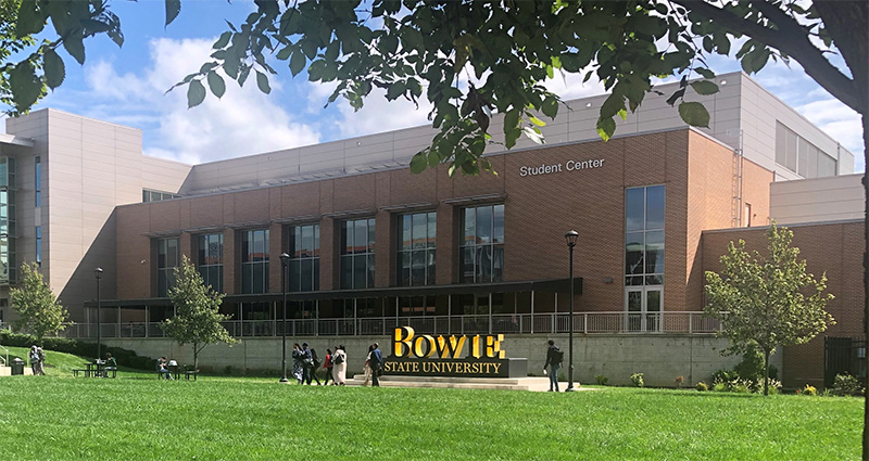 Image of the Bowie State University Student Center, with the Text University Logo, with RITA UARC members passing by
