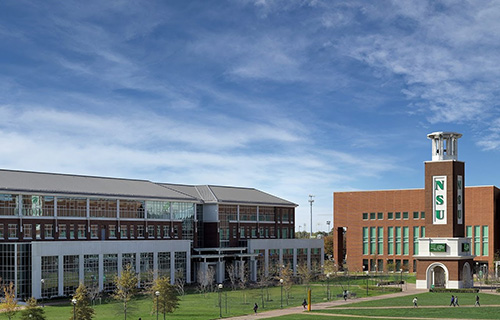 An image of Norfolk State University Tower on a beautiful day with clouded blue skies